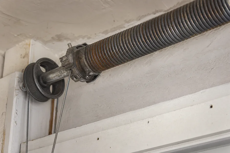 Torsion spring, shaft and cable drum above a garage door in Pittsburgh, PA